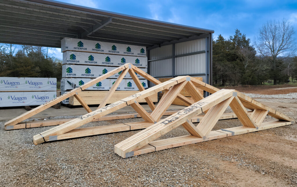 wood trusses on ground at capital truss